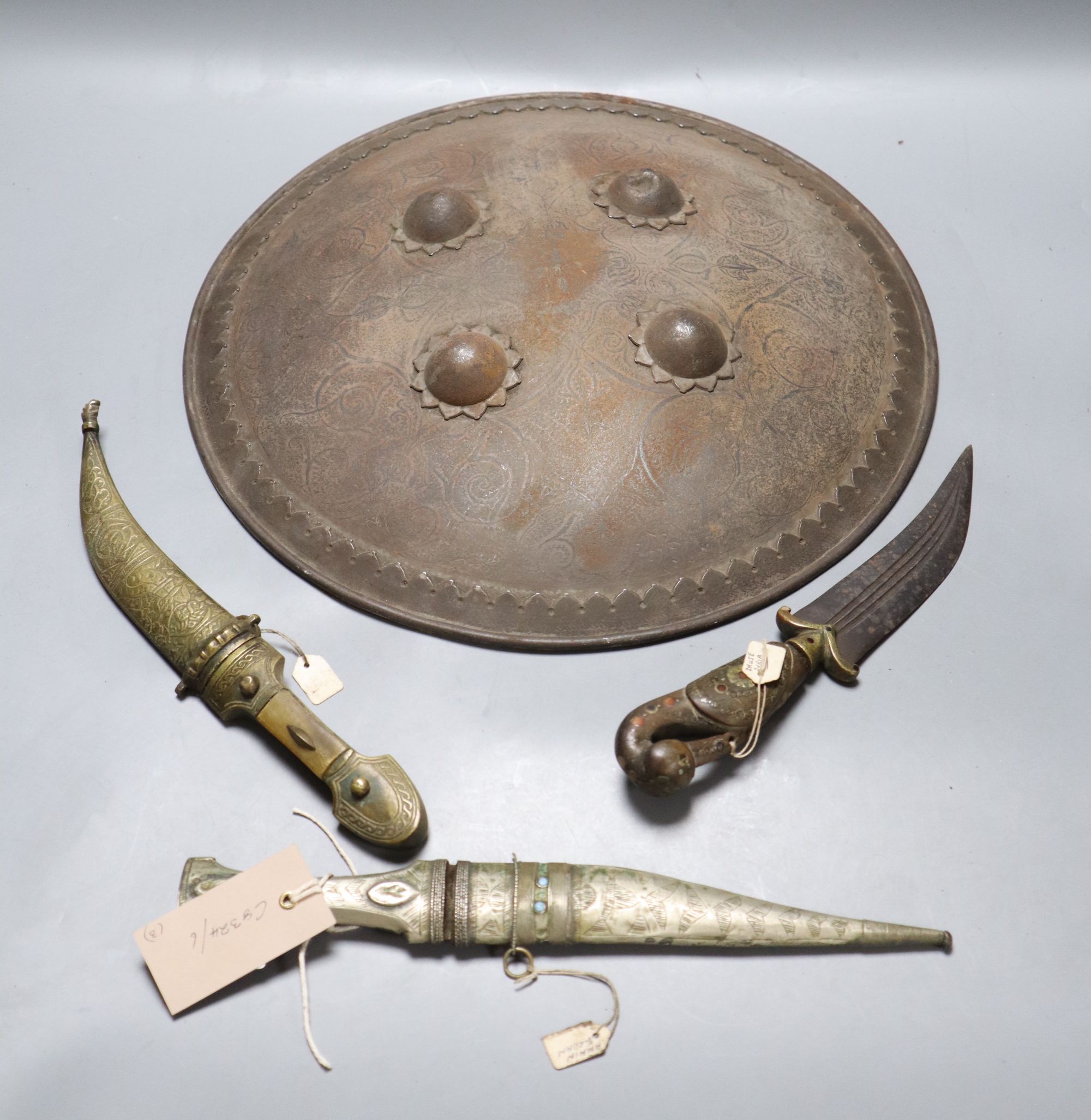 Two Syrian daggers, a Jordanian dagger and a shield